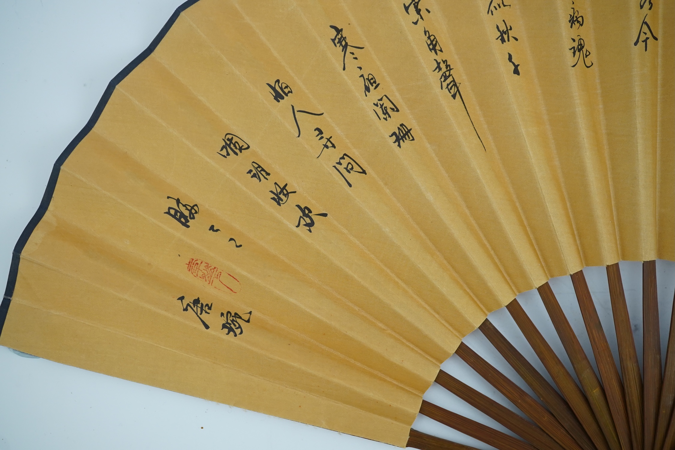 A fine Chinese sandalwood brise fan with finely carved sticks and guards, together with a mid 20th century silk calligraphic poetry LuYou fan, brise fan 38cm wide. Condition - minute damage to carving on one stick, sanda